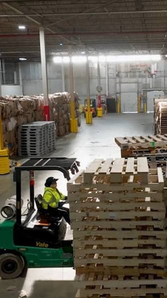 Envita Solutions warehouse operations, forklift moving palletized material
